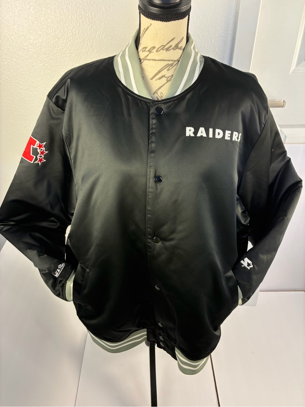 Mitchell & Ness Black Raiders Satin Bomber Jacket